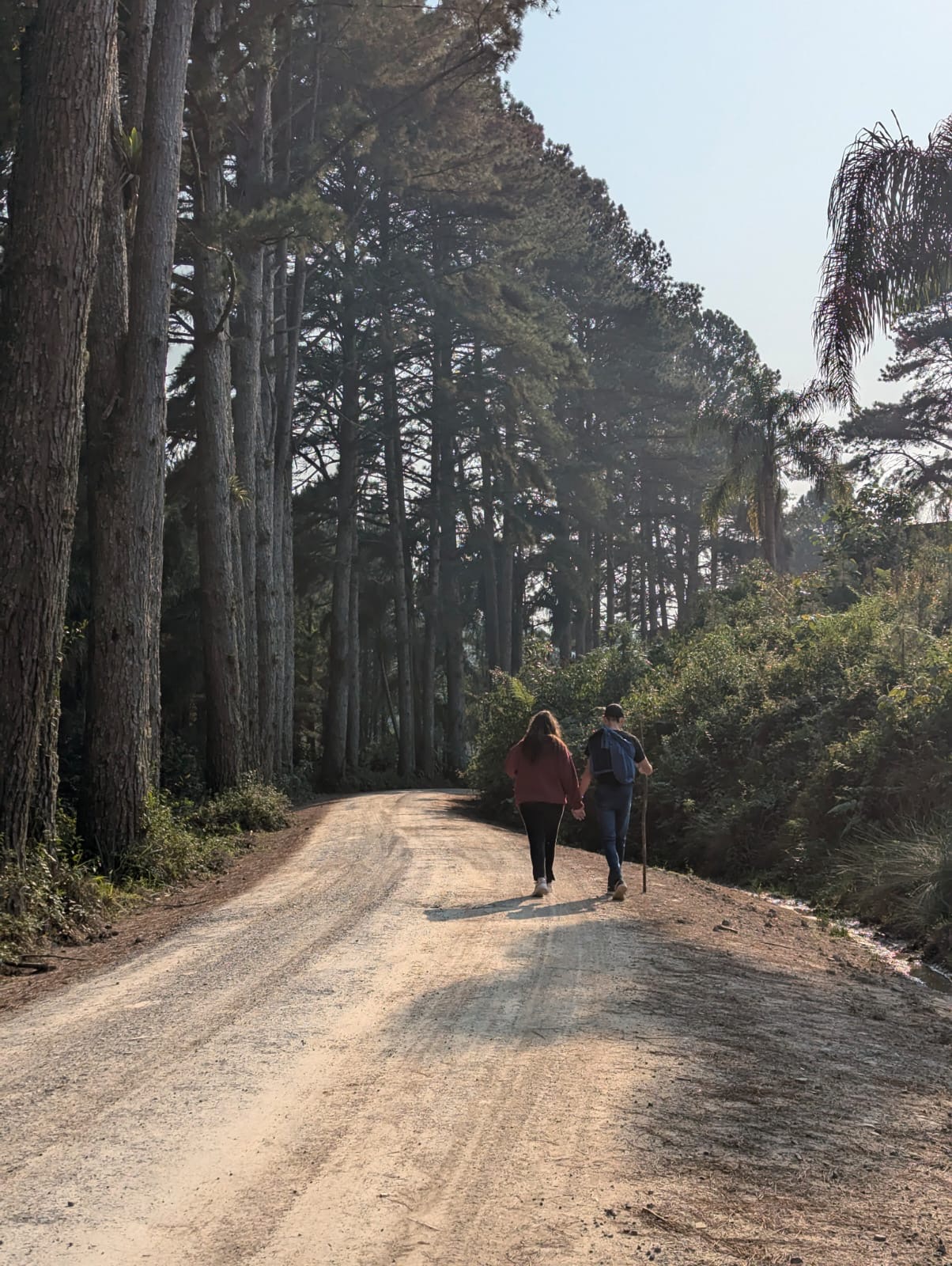 Couple walking together on a quiet path - navigating the loneliness that can come with the childfree lifestyle
